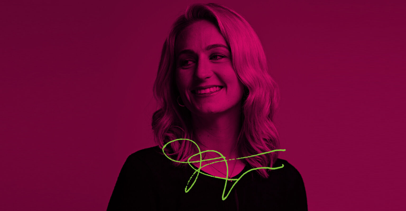 Ofcom employee portrait - Janelle giggles poisefully