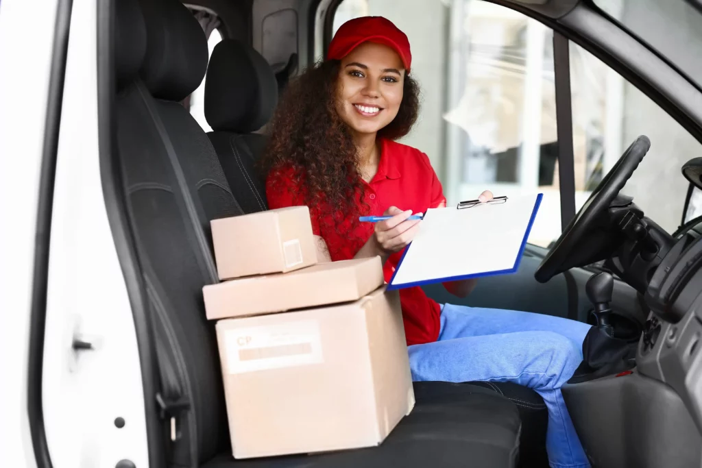 Amazon female delivery driver smiles while asking for a signature