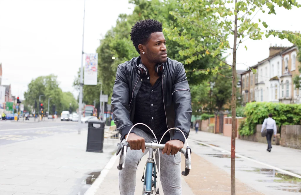 Church of England- young man cycling to work