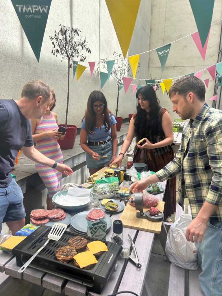 Creative team enjoying a bbq on the terrace under bunting